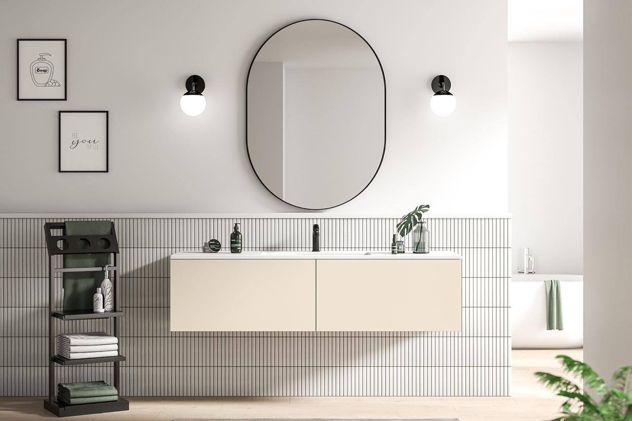 Stilvolles Bad nach Mass mit elegantem Design Massgefertigtes Bad mit minimalistischem Waschtisch, ovaler Spiegelfront und dekorativen Wandlampen, ergänzt durch dezente Wandkunst.
